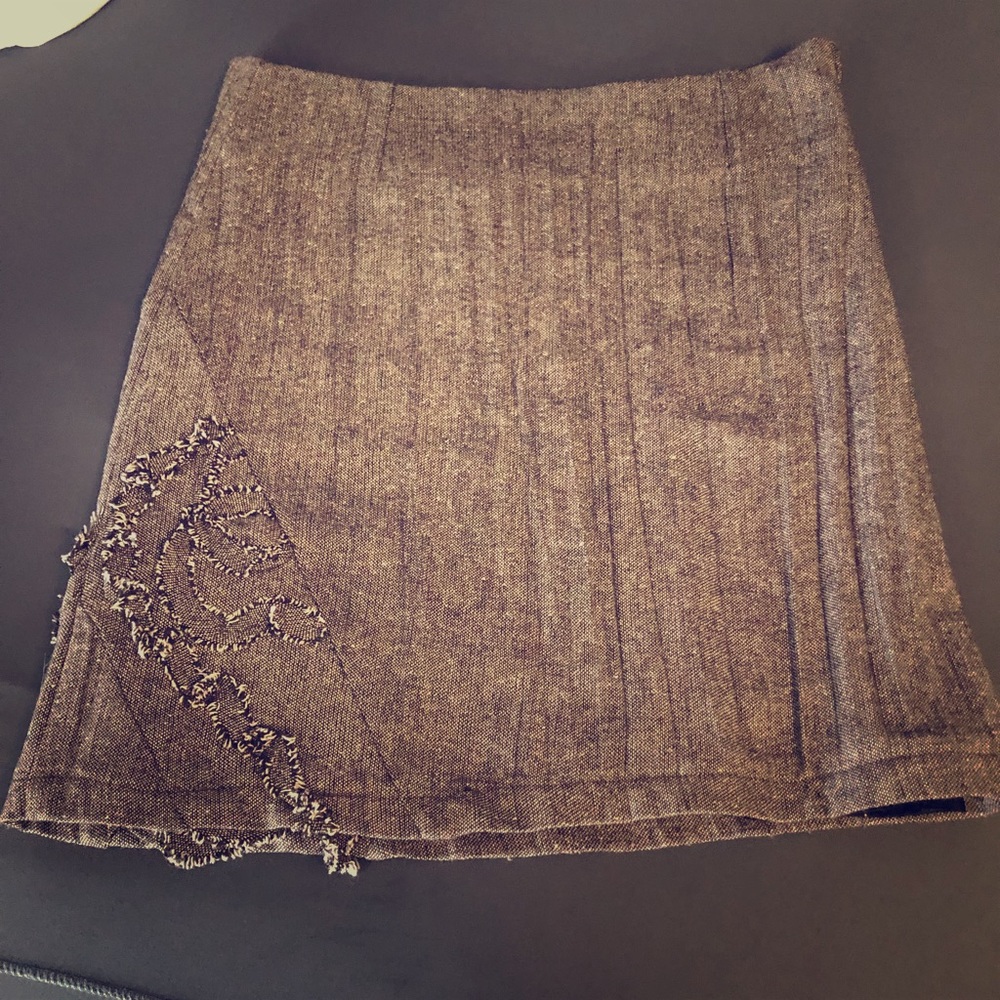Cute brown mini skirt with detail on bottom corner